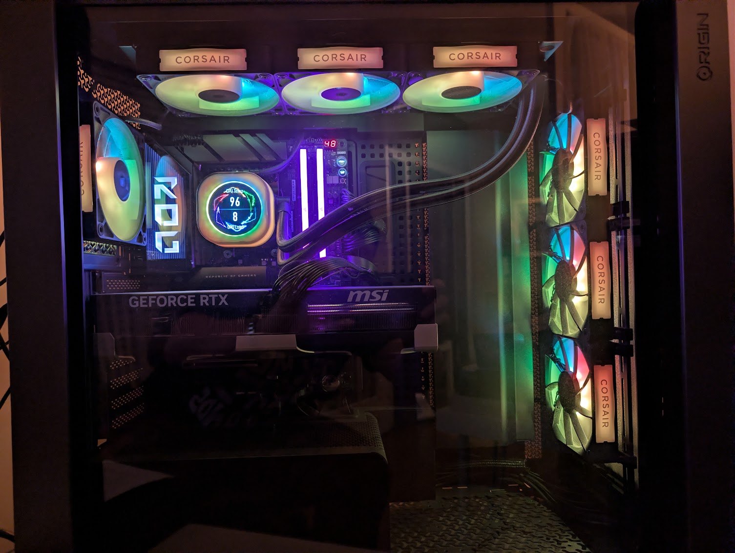 The PC case lit in blue, green and purple